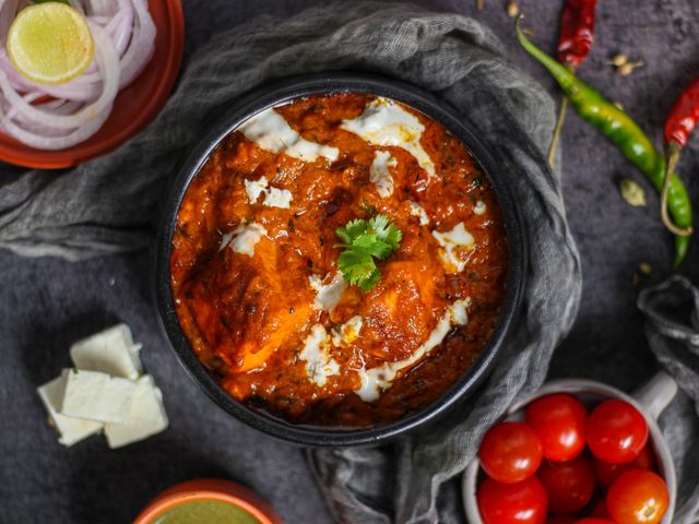 photo of a few high-protein Indian foods laid out together — eggs, paneer, dal, curd